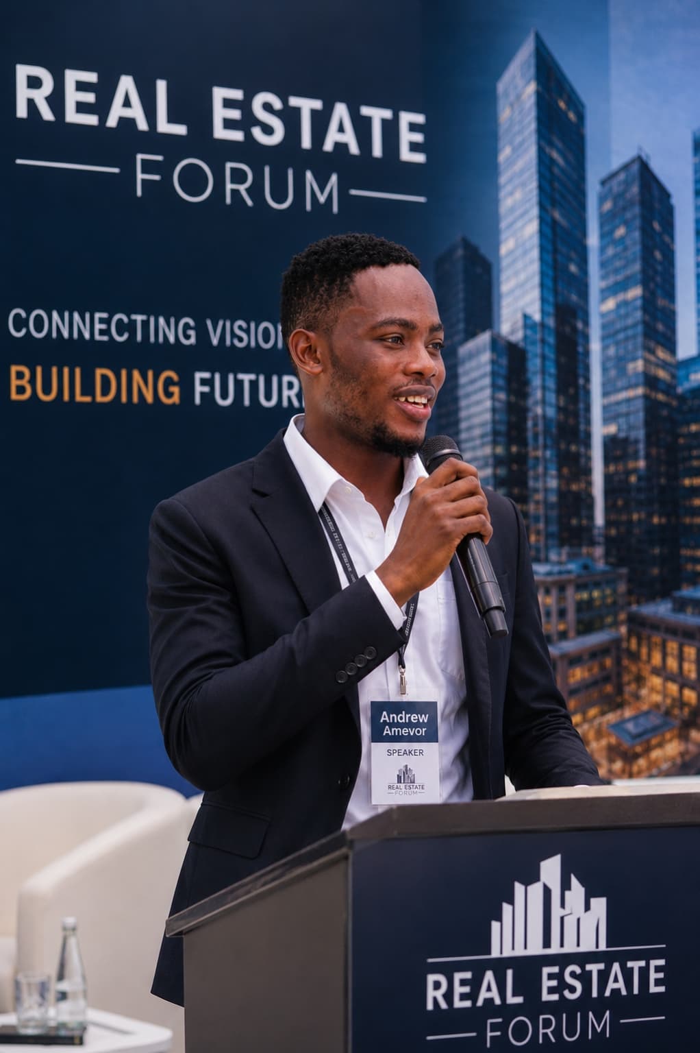 Andrew Amevor, Founder and CEO of Grace Khid Real Estate, speaking at a real estate forum